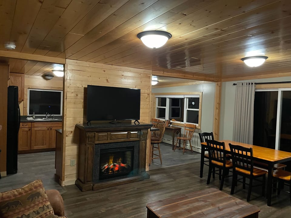 Living room, looking toward kitchen, electric heating fireplace