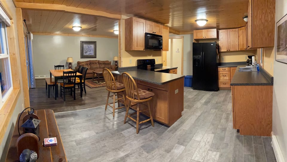 Open floor plan with fully equipped kitchen.