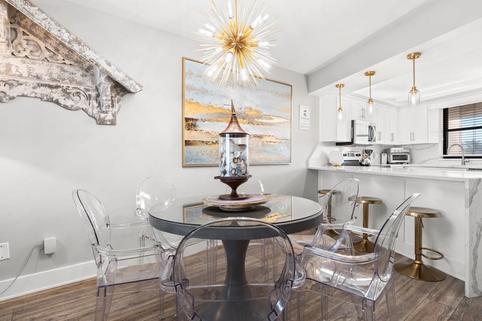 Fully equipped kitchen near dining area with breakfast bar seating three guests.

Professionally Managed by
Breathe Easy Rentals