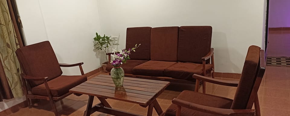 Family Quadruple Room | Living area | 22-inch LED TV with satellite channels, TV