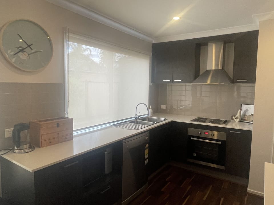 Kitchen with electric stove and dishwasher 
