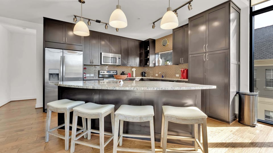 Gourmet Kitchen: Whip up culinary delights in this stylish, sunlit kitchen with modern fixtures!