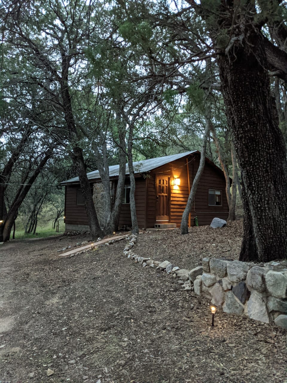 View of Creekside cabin when pulling up at dusk.