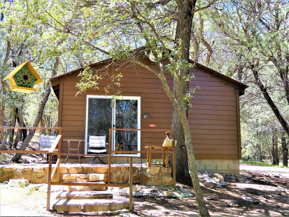 Private patio area with suet, seed and nectar bird feeders w/ seating to enjoy.
