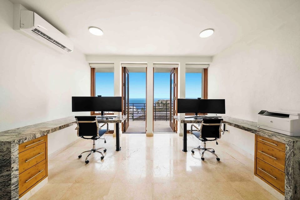 Fully Equipped Office with high-speed internet, 49" Curved Monitors, Laptops, and Printer.