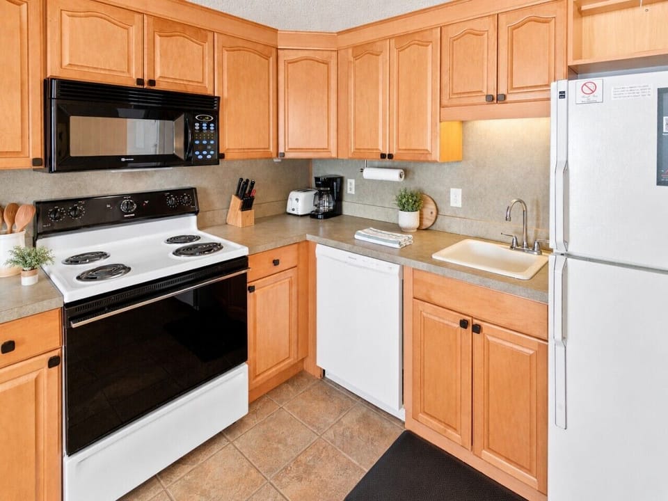 Remodeled kitchen is fully-equipped with pots, pans & utensils