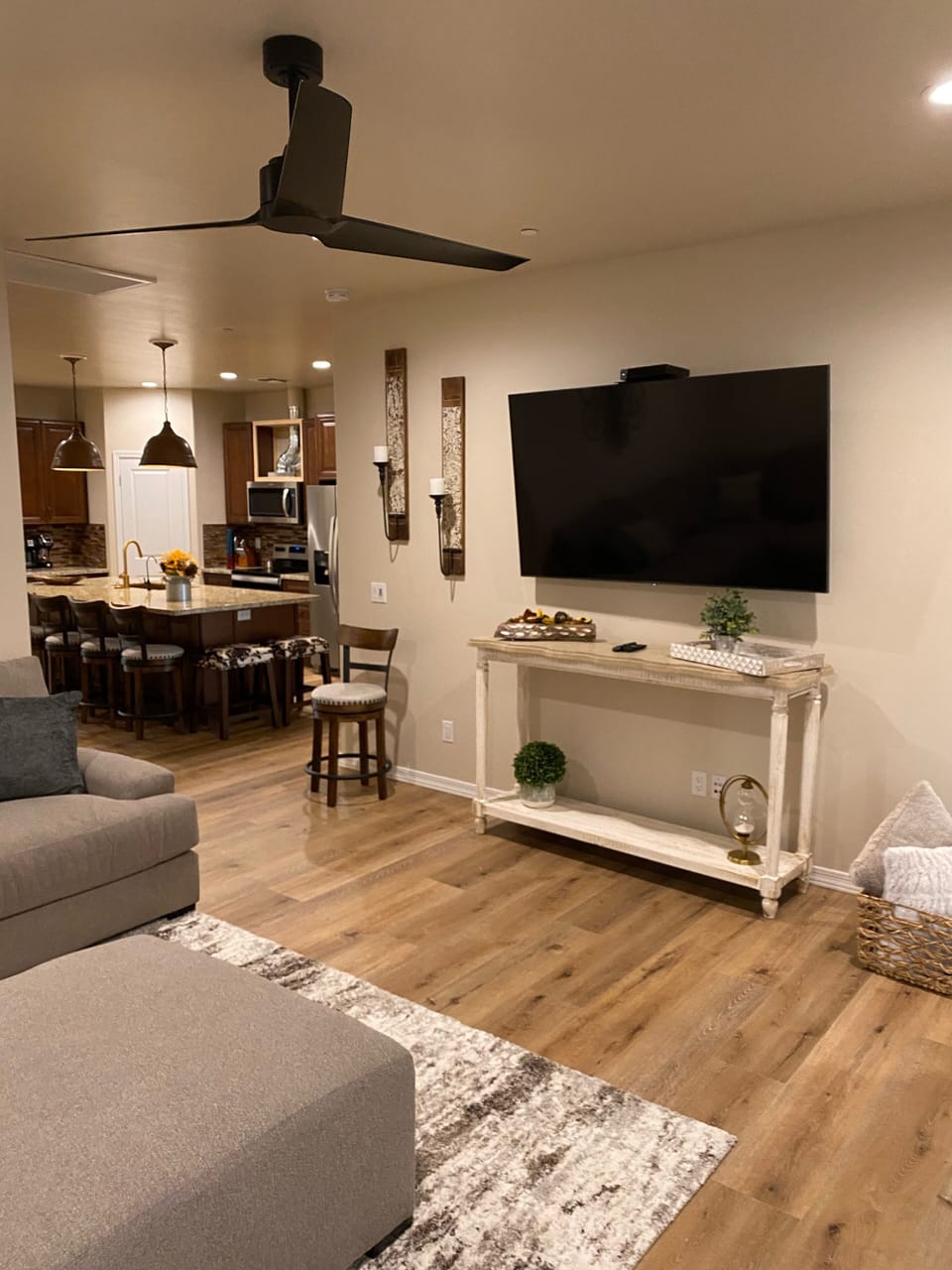 Large family room with 70” flat screen TV. 