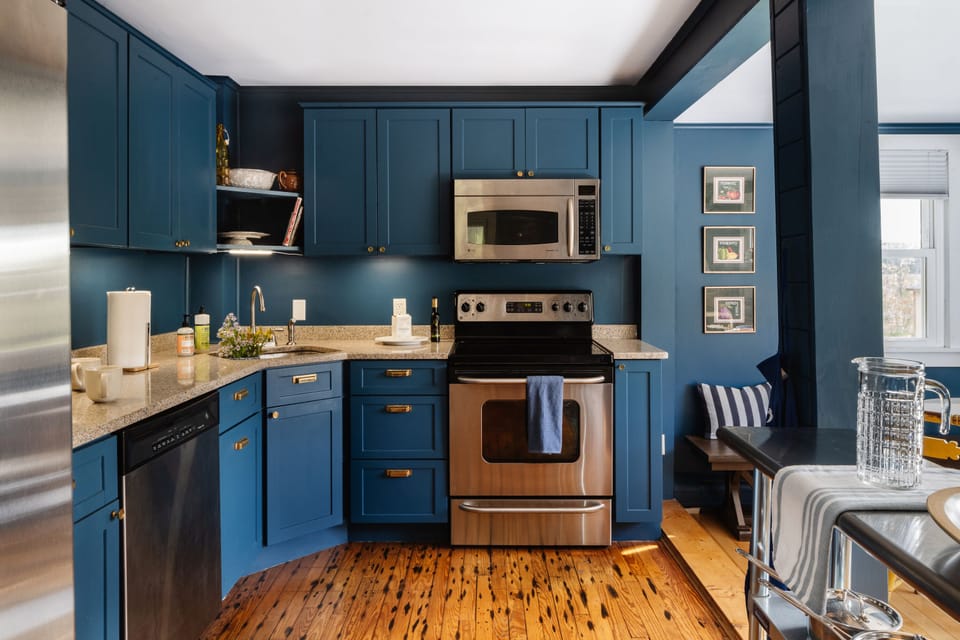 Kitchen with oven, stove, microwave, coffee maker, dishwasher, toaster, and more.