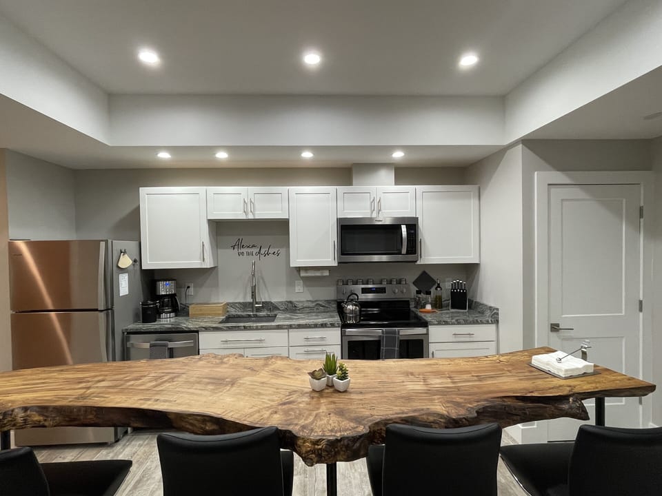 Kitchen with beautiful handcrafted maple table…