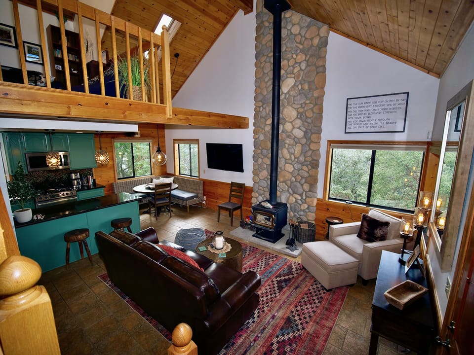 Living Room features floor to ceiling stone fireplace.