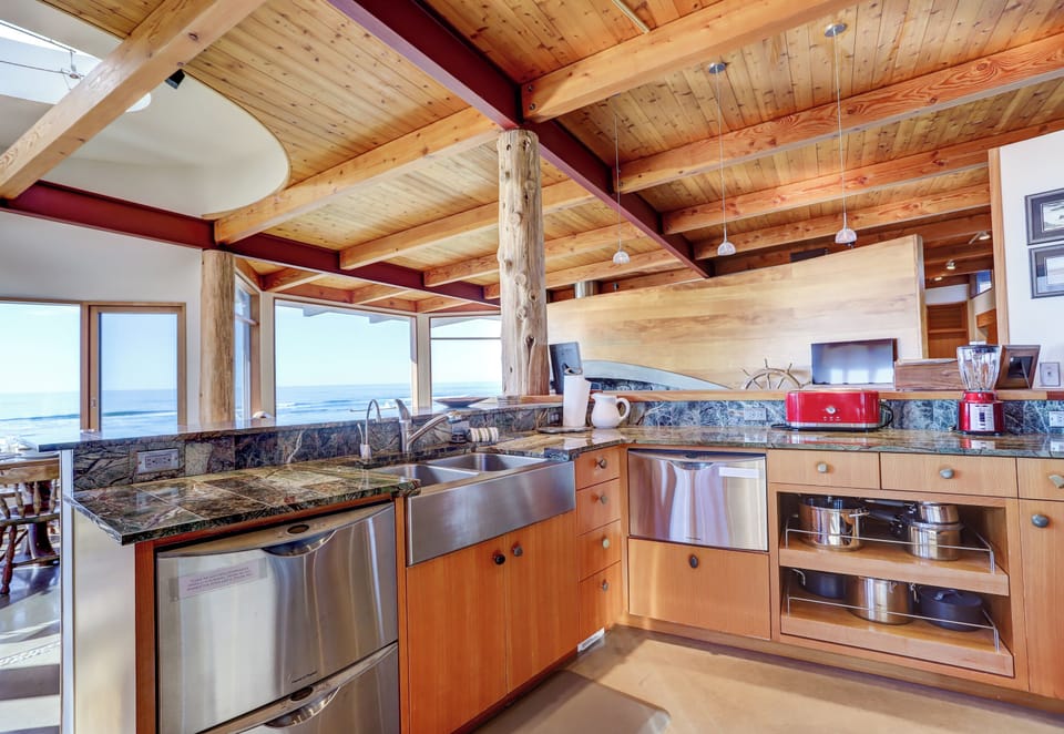 The kitchen is well stocked with quality dishware, dinnerware, and bakeware.