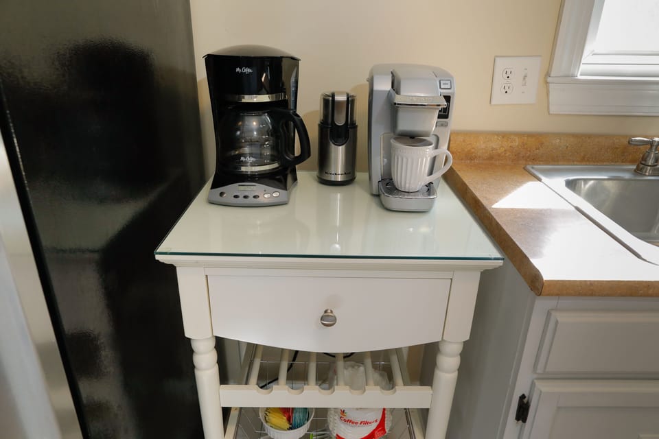 Coffee station stocked with Keurig pods and ground coffee. Or grind your own!