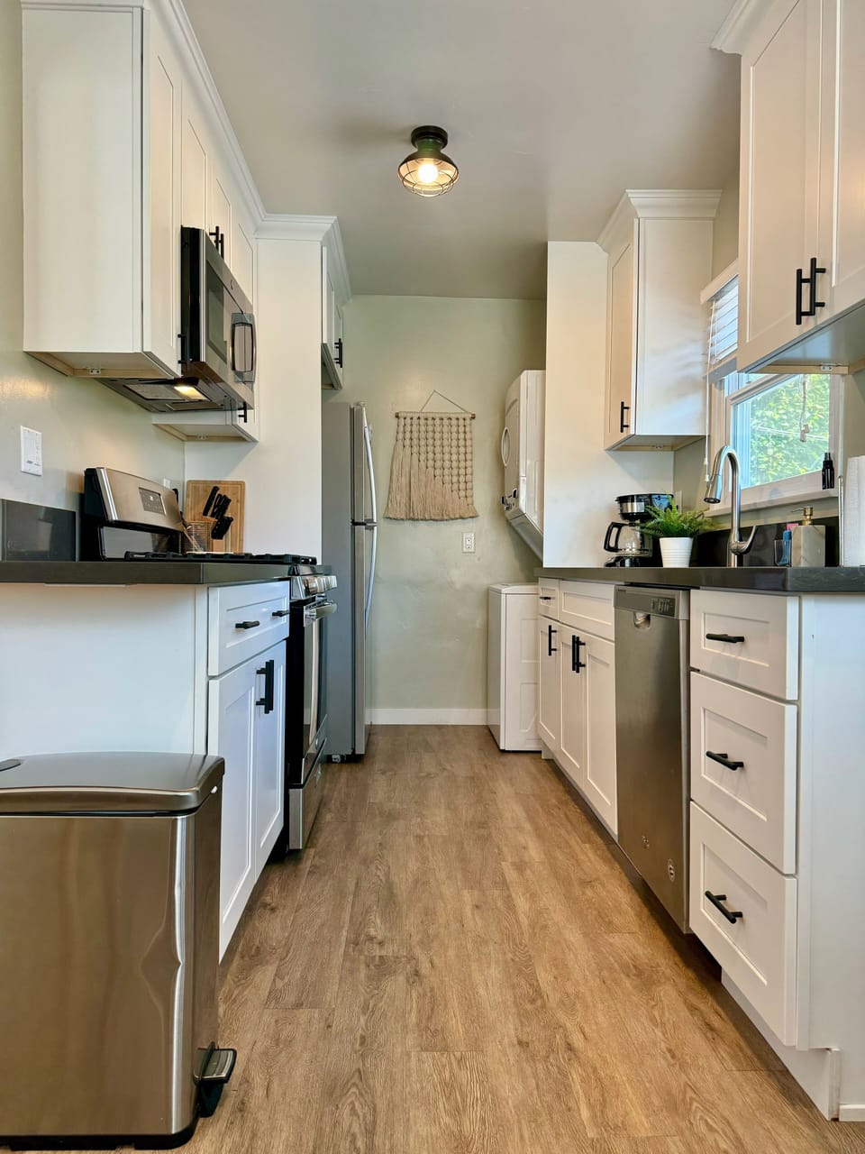 Gas stove and oven, washer/dryer, dishwasher, dining table for two