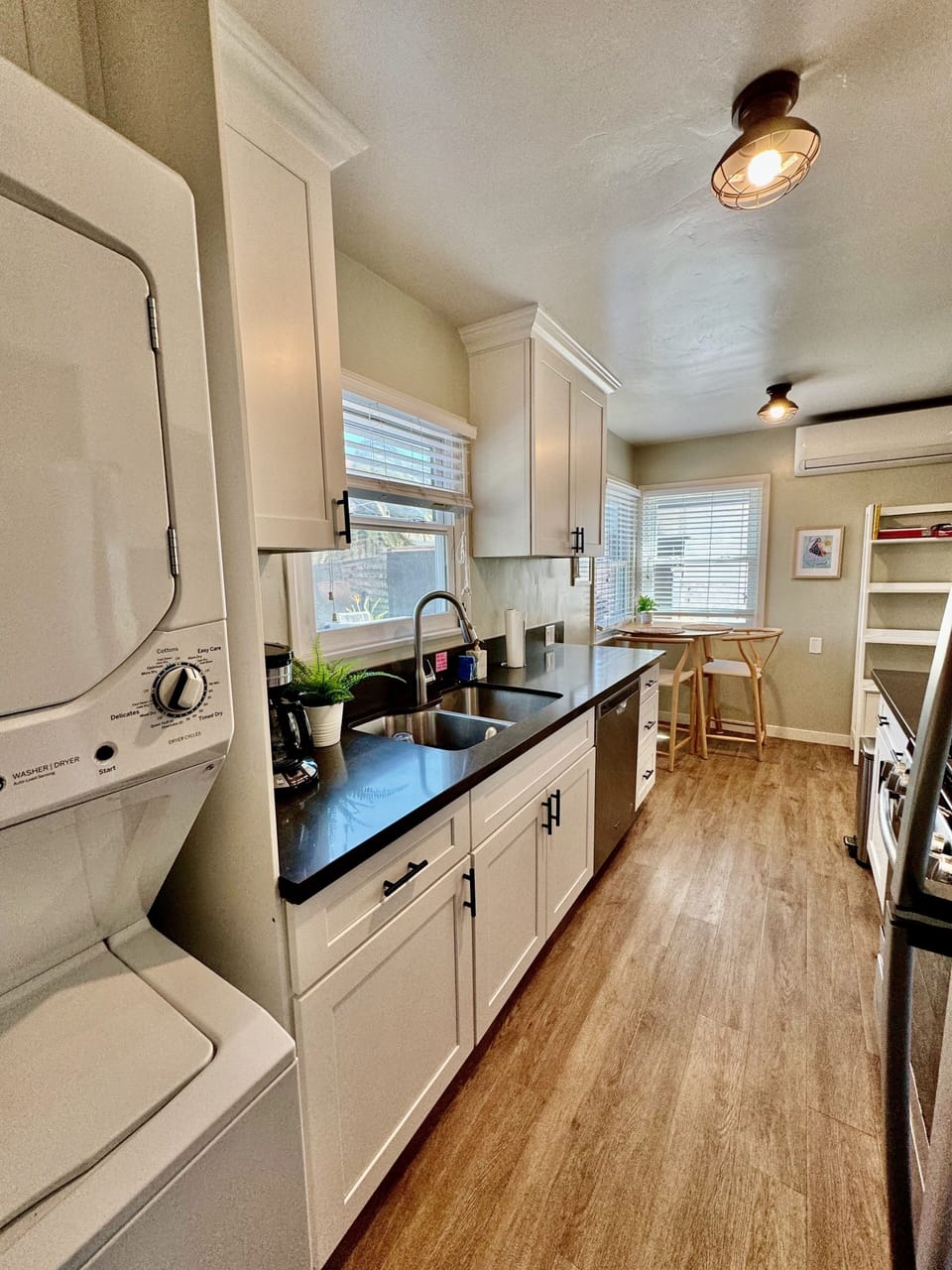 Gas stove and oven, washer/dryer, dishwasher, dining table for two