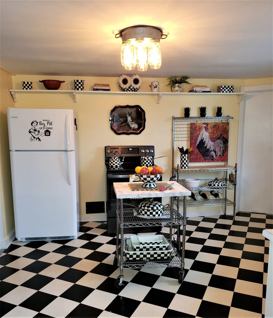 Kitchen with MacKenzie Childs bowls and cookware
