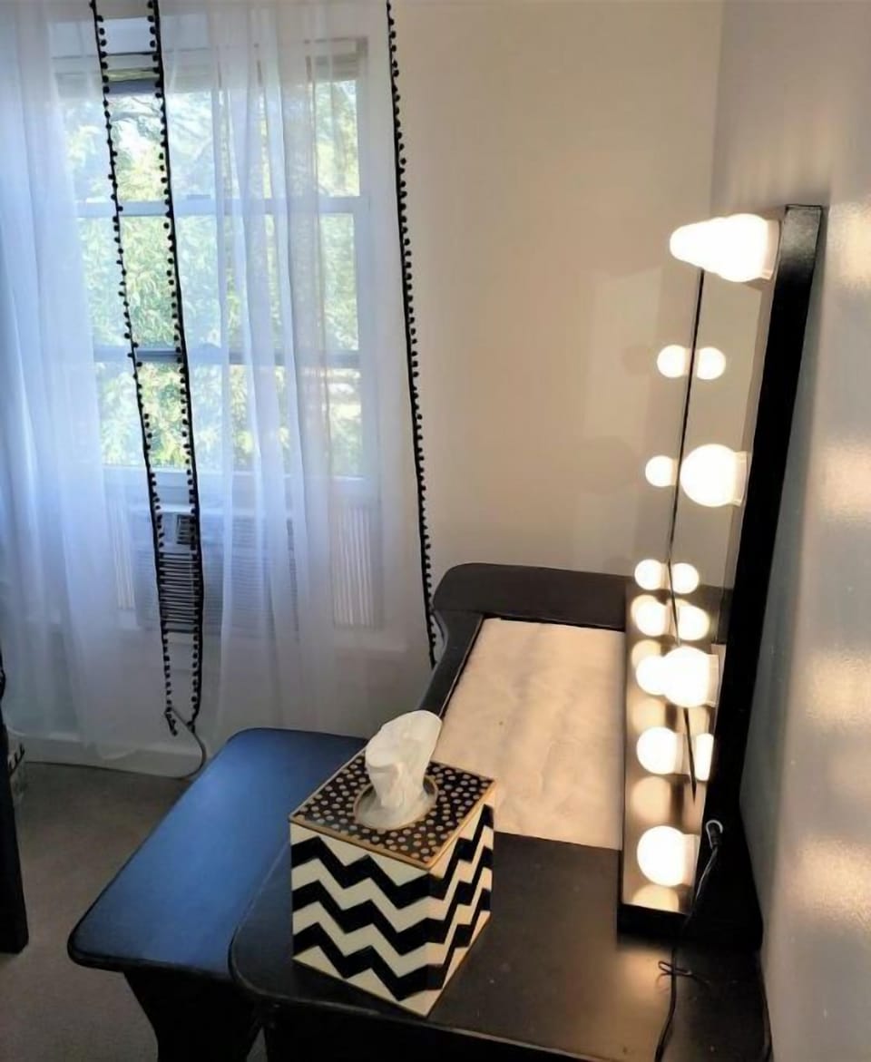 Vanity & Hollywood Makeup Mirror for getting ready.  Huge Walk in Closet across