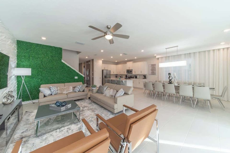 The living room seamlessly connects to the kitchen and dining room, creating a wonderfully spacious area.