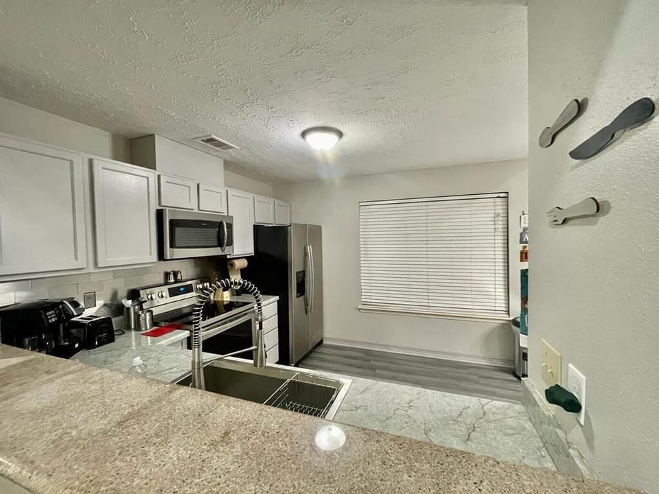 Overlooks the Kitchen Counter