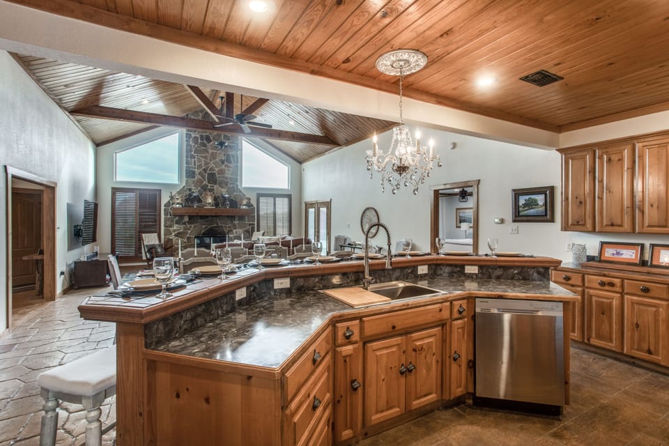 Well equipped kitchen with stainless refrigerator and modern convection oven