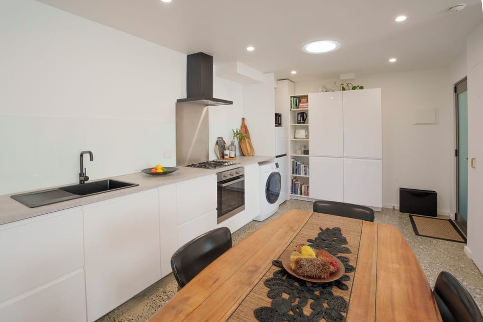 Enter into the kitchen of the Garden Studio via the sliding doors