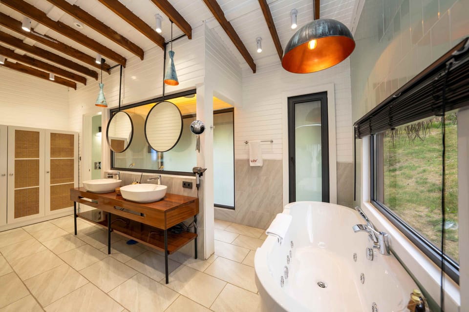 Separate tub and shower, rainfall showerhead, free toiletries
