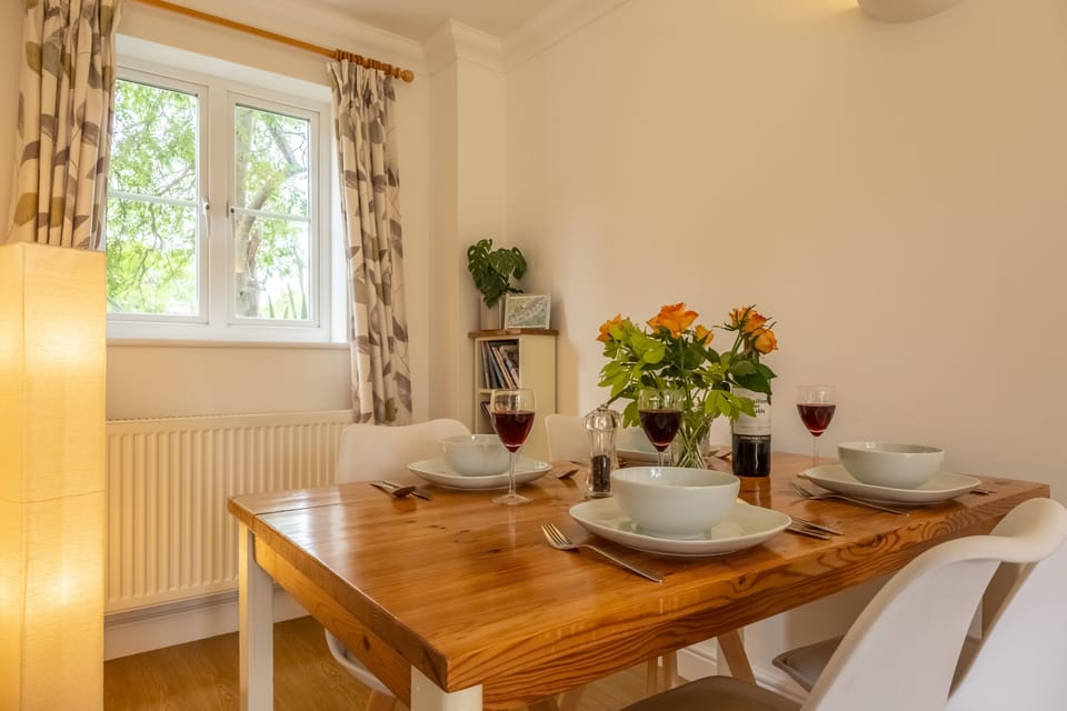 Ground floor: The dining table has seating for four people