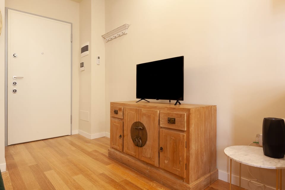 Apartment, 1 Bedroom | Living area | Flat-screen TV, heated floors
