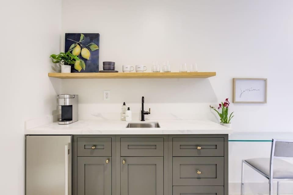 Kitchenette with Nespresso coffee machine, microwave & mini fridge