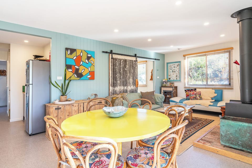Gather around the six-seater dining table in this charming space, perfect for enjoying home-cooked meals with family and friends.