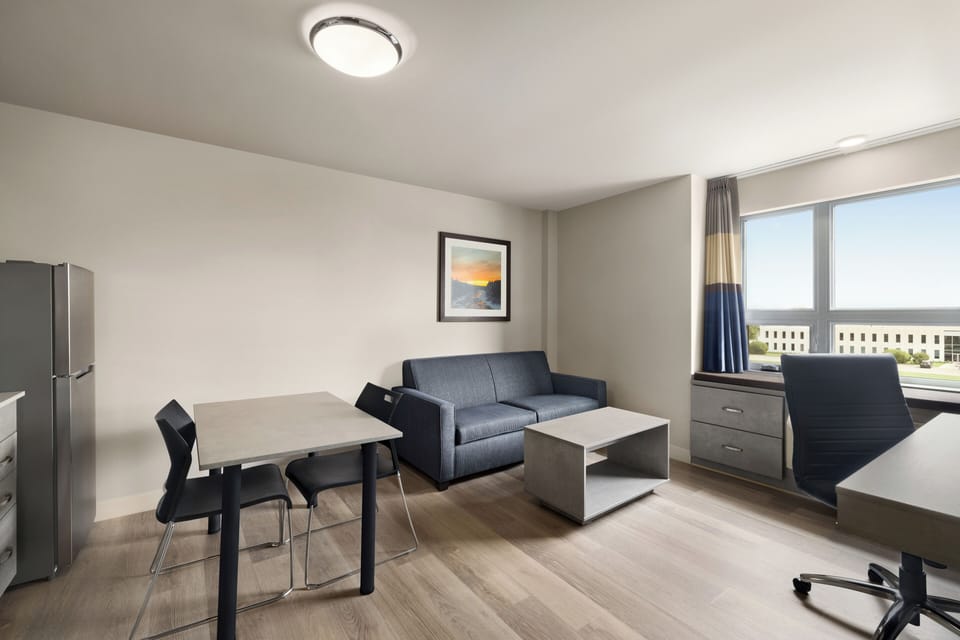 Suite, 1 Bedroom, Non Smoking | Living area | 55-inch flat-screen TV with cable channels, TV