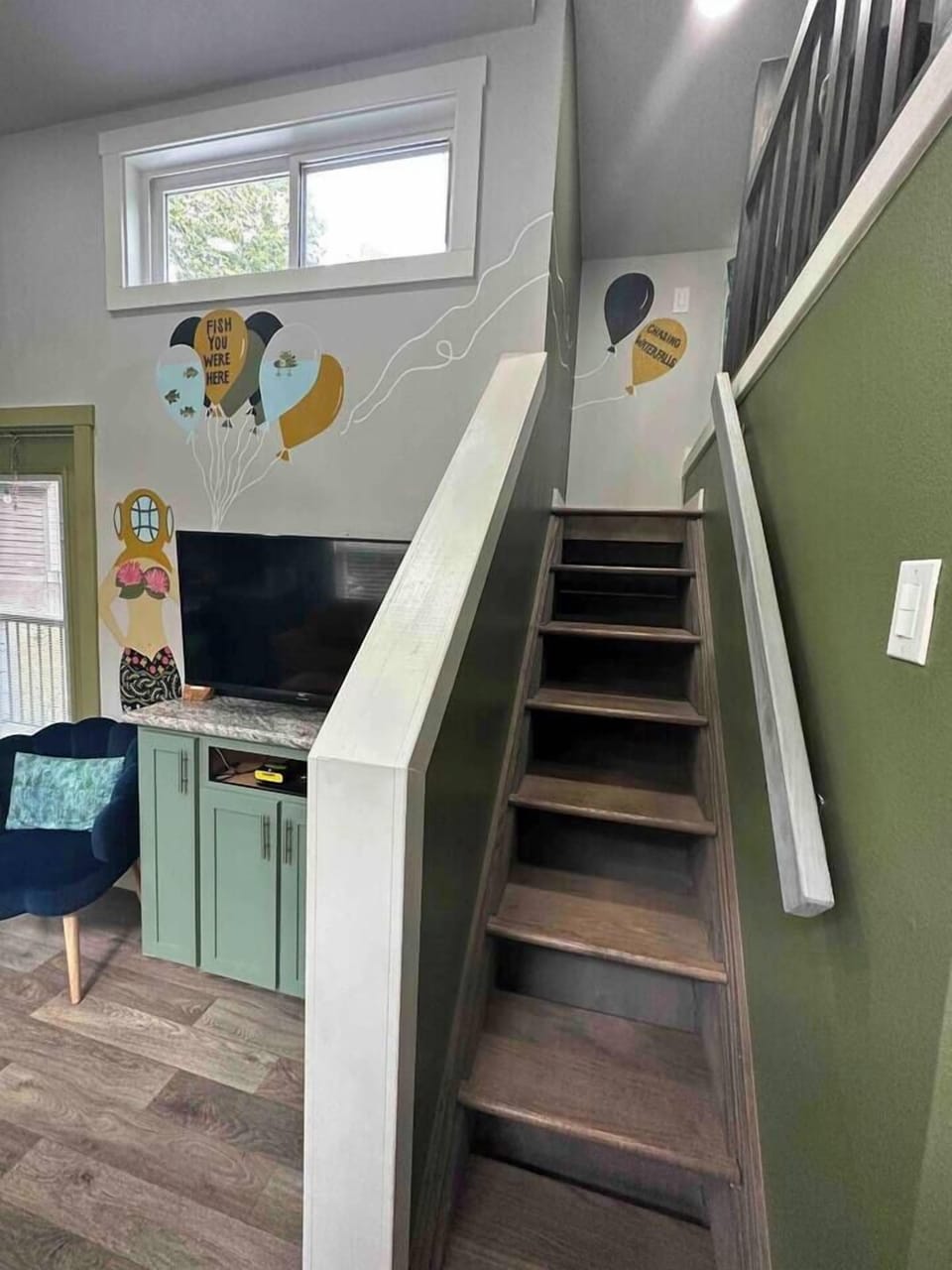 Loft stairs leading up to the cozy sleeping area.