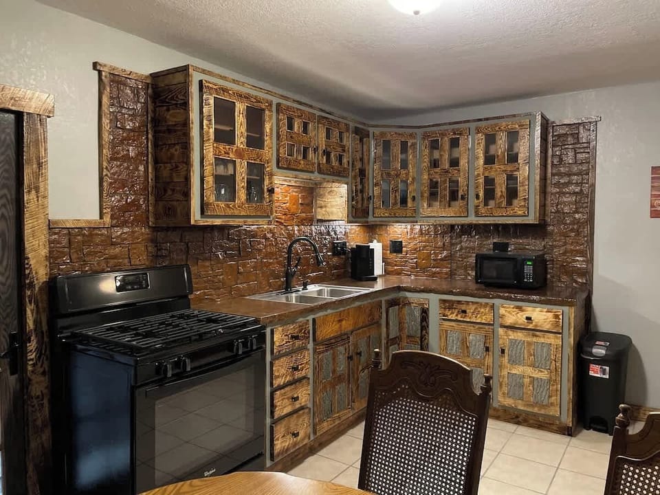 Fully Equipped Rustic Kitchen with Custom Woodwork