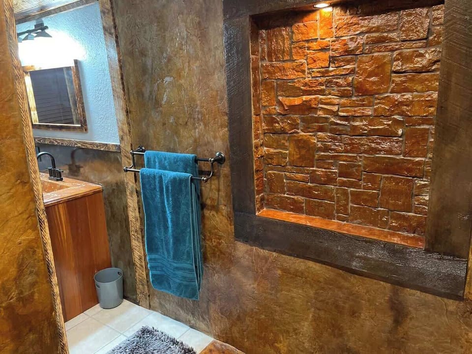 Shower looking out into bathroom 