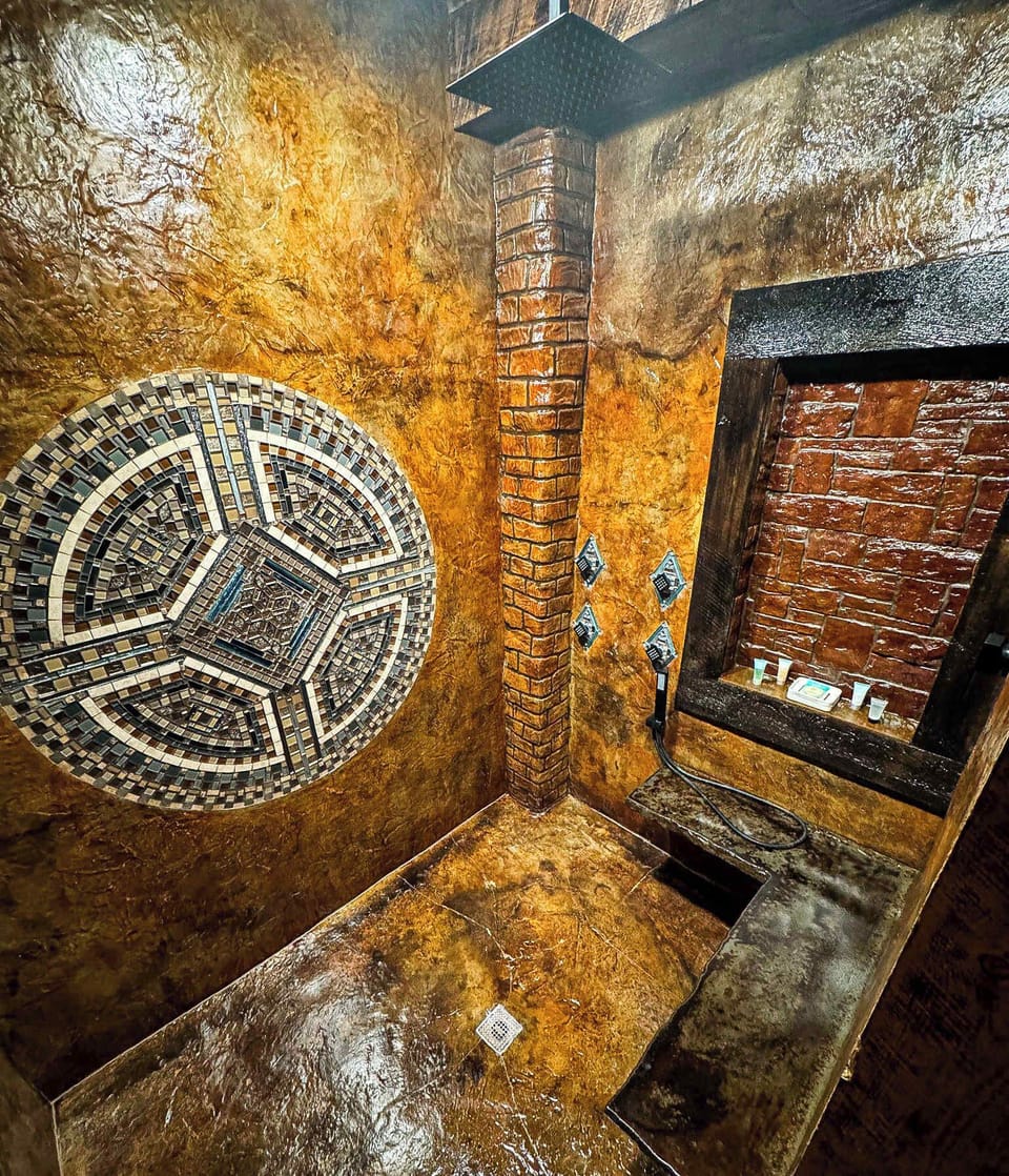 Custom Luxury Shower with Handcrafted Mosaic & Stonework