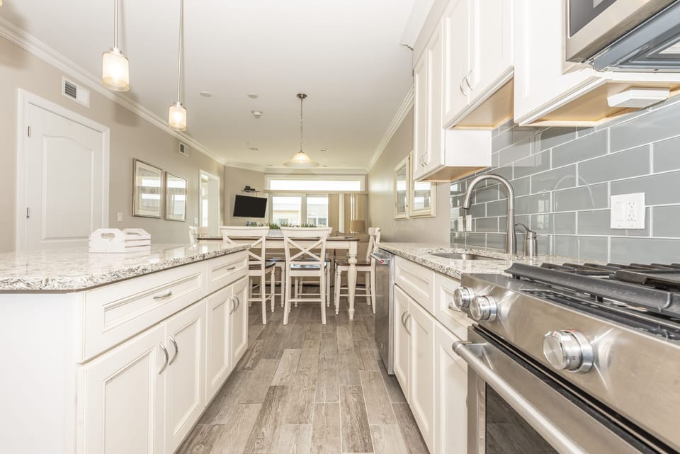 kitchen with gas stove and custom tile