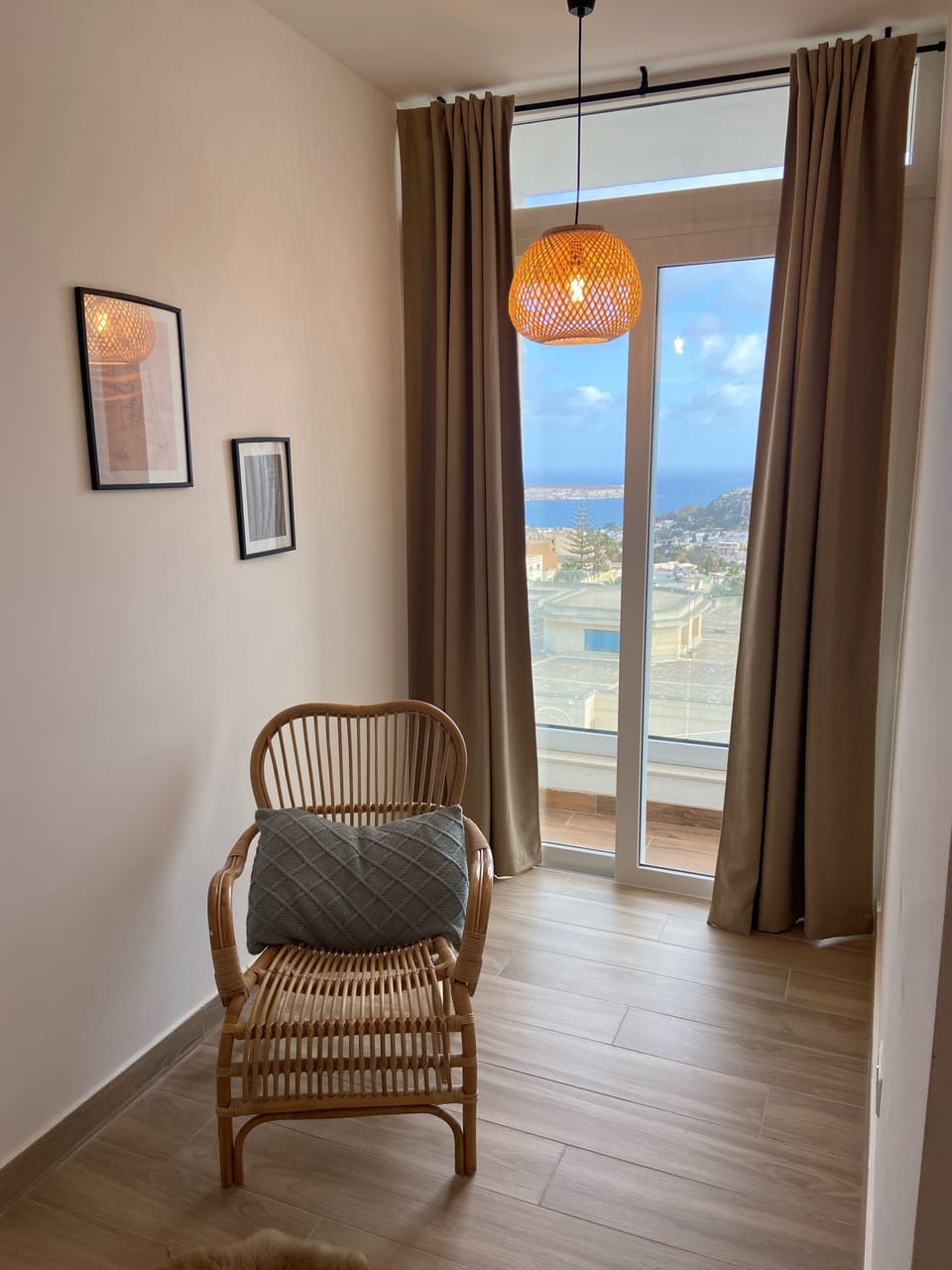 main bedroom 1 with seating area and views