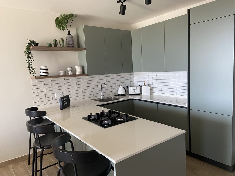 Fully equipped kitchen with Hob, Oven, microwave, fridge and freezer.