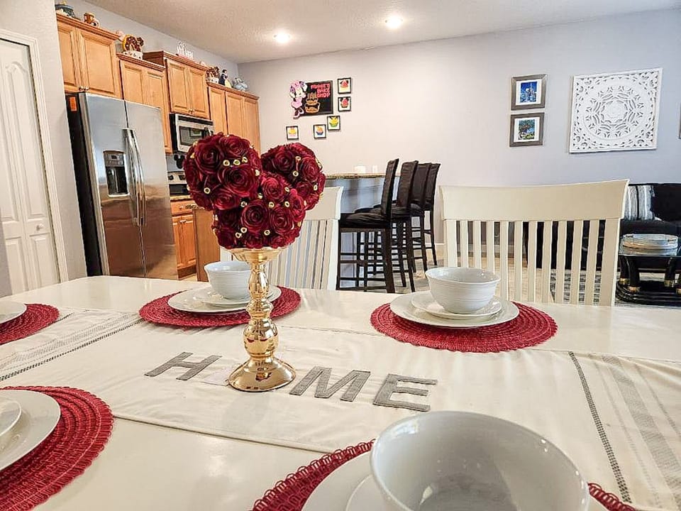 1st Floor- Charming dining area adorned with Disney decor features six chairs