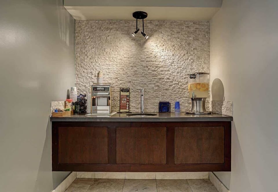 24-hour Lavazza Espresso and Cappuccino bar including Teas, Purified infused water with fresh fruit or fresh mint.  Condiments available. 