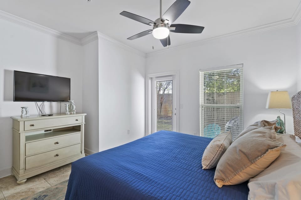 4th bedroom is downstairs with king bed and patio access
