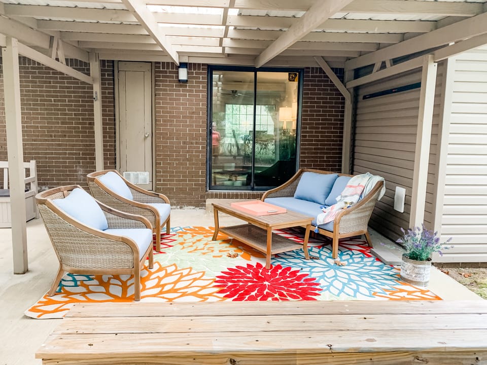 Quiet covered back porch with grill