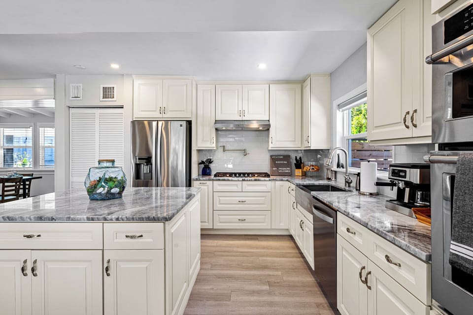 Oven / microwave stack separate from gas range and pot filler