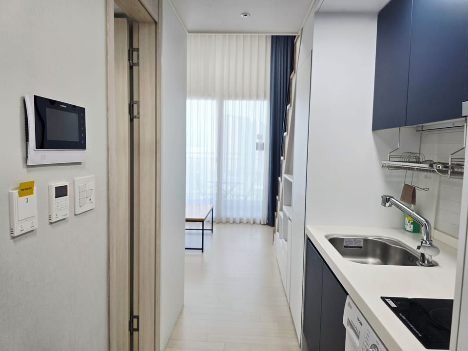 Fridge, microwave, electric kettle, cookware/dishes/utensils