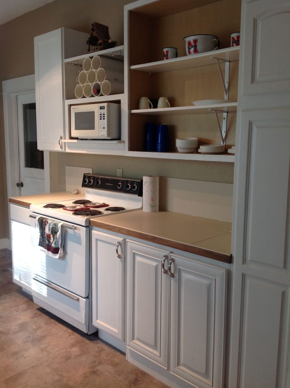 Stove, microwave, pots and pans.  Perfect place for making of those morning meal