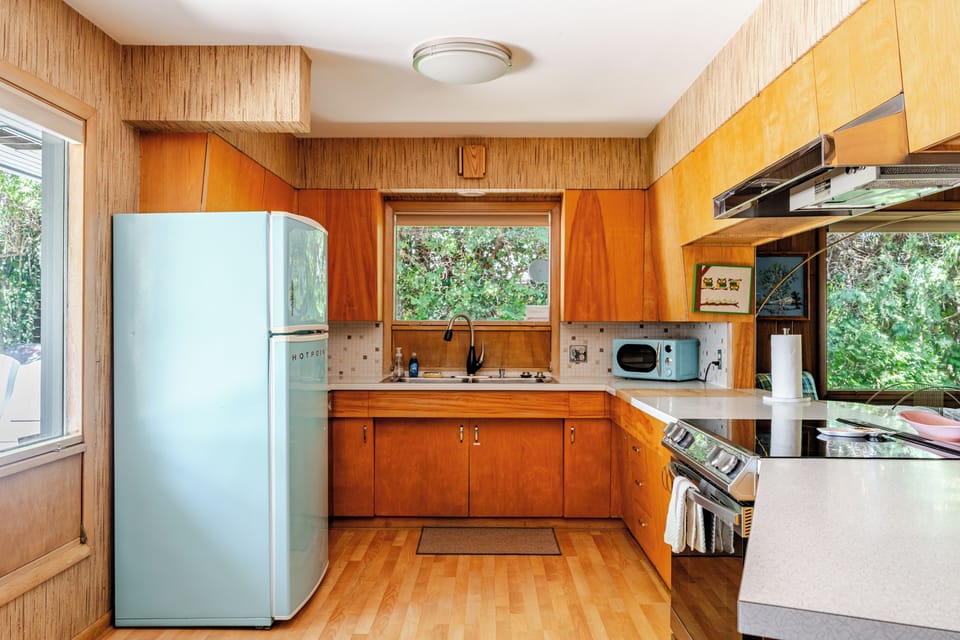 You won't find a blue fridge and boomerang countertops anywhere else.