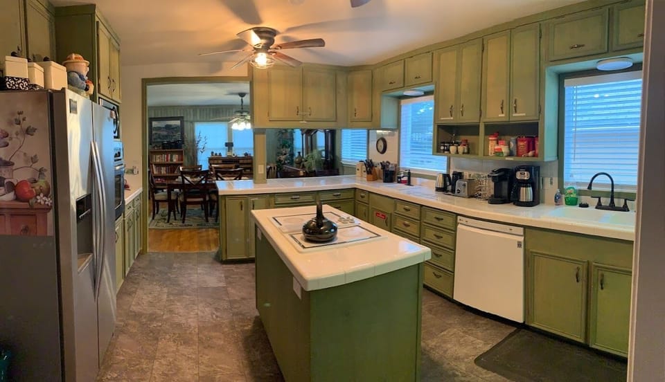 Kitchen has everything a cook would need for cooking.