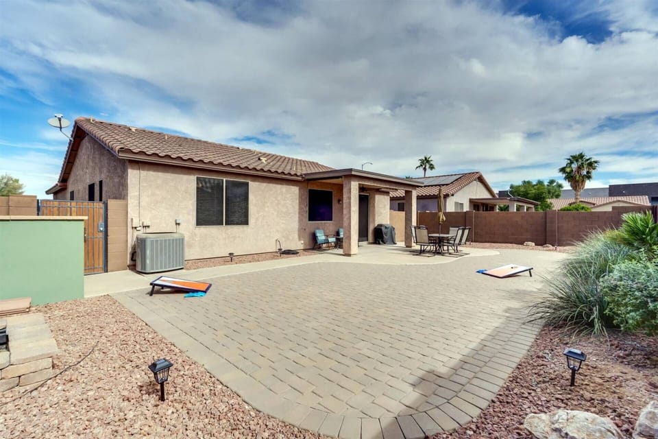 Set up cornhole and have a backyard BBQ