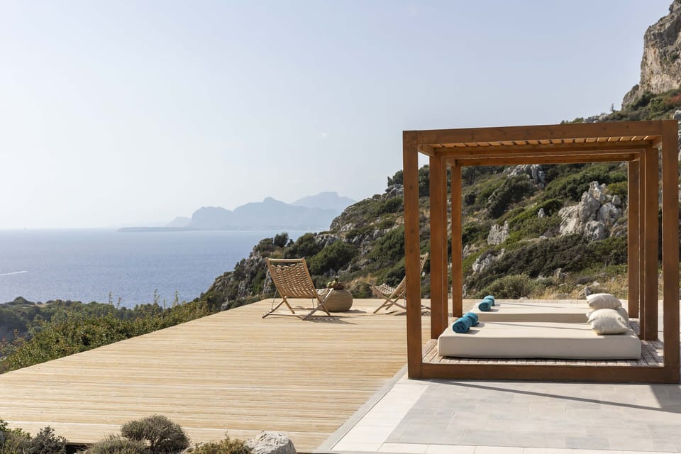 An infinity pool, overlooking the Aegean Sea deep blue.