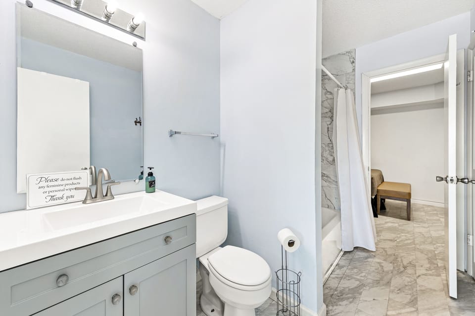 Newly remodeled bathroom: Jack-and-Jill Bathroom 1 has a shower/tub combo that's shared by Bedrooms 1 and 2.