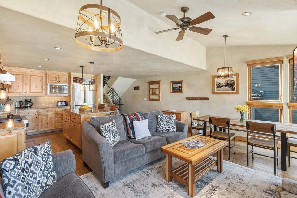 The spacious great room blends kitchen, dining, and living areas—perfect for entertaining or relaxing together.